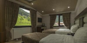 Ένα ή περισσότερα κρεβάτια σε δωμάτιο στο Gelgor Hotel