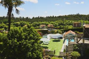 an aerial view of a yard with a playground at La casa de los Barbazanes in Brion +40 photos