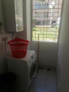 a washing machine with a basket on top of it at S2 JDC jardin de carthage in Tunis +2 photos