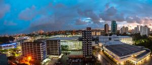 a view of a city at night at Iguatemi Business by Avectur in Salvador