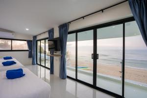 Ένα ή περισσότερα κρεβάτια σε δωμάτιο στο SeaTime Beachfront Chaam +70 φωτογραφίες