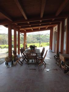 a patio with a table and chairs on it at Masseria Spadone in Civitella Casanova