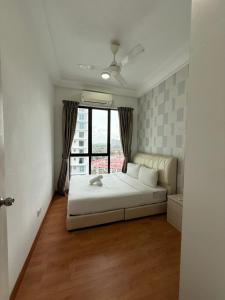 a bedroom with a bed and a large window at PB1406 Two bedroom 6-7pax beside paradigm mall in Johor Bahru