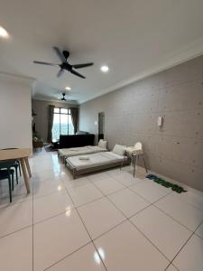 a living room with a bed and a ceiling fan at PB1406 Two bedroom 6-7pax beside paradigm mall in Johor Bahru +21 photos