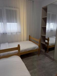 Ένα ή περισσότερα κρεβάτια σε δωμάτιο στο BT Apartments
