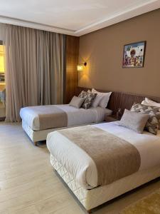 Ένα ή περισσότερα κρεβάτια σε δωμάτιο στο Hotel De Nice