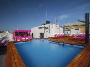 a large swimming pool on the roof of a building at TWO Hotel Barcelona by Axel 4* Sup- Adults Only in Barcelona