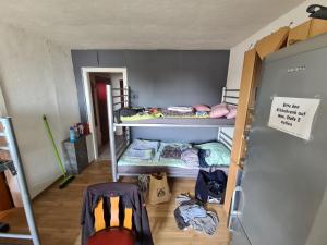 a room with several bunk beds in a room at ein Platz im Etagenbett im Durchgang in Schalke Nähe Arena in Gelsenkirchen