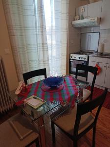 a dining room table with a plate on top of it at ΔΙΑΜΕΡΙΣΜΑ ΣΤΟ ΚΕΝΤΡΟ in Tripoli