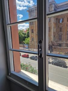 a view of a street from a window at Alessandro's Home in Rome