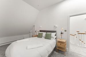 Ένα ή περισσότερα κρεβάτια σε δωμάτιο στο 3bd Stylish Modern l FREE Parking