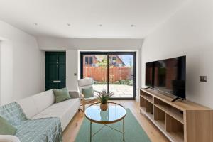 Μια τηλεόραση ή/και κέντρο ψυχαγωγίας στο 3bd Stylish Modern l FREE Parking