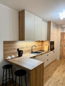 Η κουζίνα ή μικρή κουζίνα στο LOFT Apartament I Opole