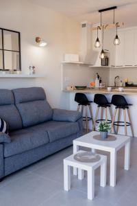 a living room with a couch and a table at Casa Guillaume in Mogán