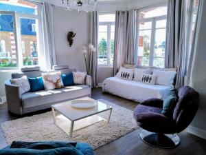 Posezení v ubytování Emplacement exceptionnel Appartement très lumineux au cœur de Cabourg