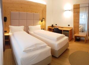 Giường trong phòng chung tại Hotel Villa Rosa