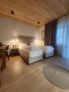 Giường trong phòng chung tại Hotel Villa Rosa
