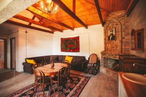 a living room with a table and a couch at Ethno Village in Shilda