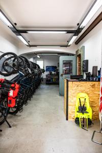 a bike shop with a bunch of bikes on racks at Palazzo ReSilente- Ostello in Castelnuovo Cilento