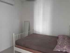 Ένα ή περισσότερα κρεβάτια σε δωμάτιο στο Affordable Stay in Tasik Raban