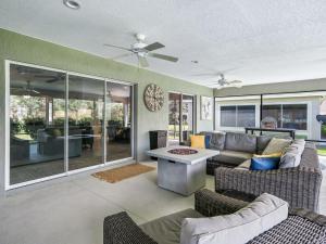 a living room with a couch and a table at 3215 Z6 VILLAGE OF FENNEY by REMAX Premier in The Villages