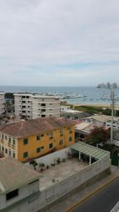 a view of a city with buildings and the ocean at Chipipe Riviera del Mar in Salinas