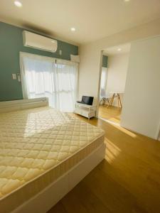 Ένα ή περισσότερα κρεβάτια σε δωμάτιο στο Hiregasaki, Nagareyama 2号