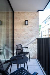 two chairs and a table on a patio at Madame Sardine in Ostend