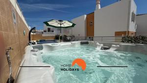 a hot tub on the roof of a building at #343 Villa with Pool & Jacuzzi by Home Holidays in Vale de Pedras