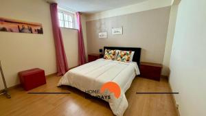 a bedroom with a bed in a room with a window at #343 Villa with Pool & Jacuzzi by Home Holidays in Vale de Pedras +37 photos