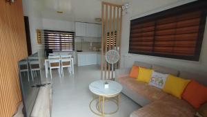 a living room with a couch and a table at Danielle's Haven in Naga