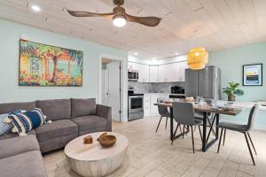 a living room with a couch and a table at Sea Escape - Pet Friendly, Located in Siesta Key Village, Steps to Siesta Key Beach! in Bailey Hall