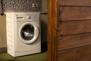 a washing machine in a room next to a door at Terrazze Dannunziane in Pescara