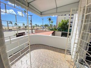 a room with a view of a building at Casa Frente Mar na Cidade Luz in Fortaleza