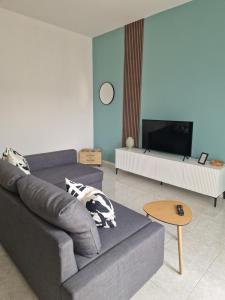 a living room with a couch and a tv at House 13 apartment in Cernobbio in Cernobbio