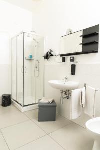 a bathroom with a glass shower and a sink at Terrazze Dannunziane in Pescara +104 photos