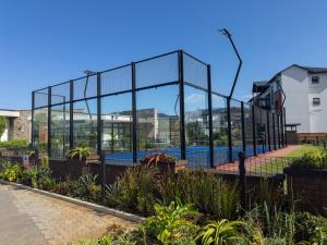 a large glass building with a pool in it at Blissnest in Ballito