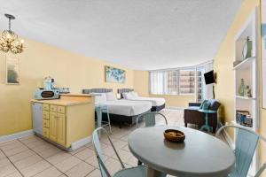 a living room with a couch and a table at Top Of The Gulf 507 Beach Front Resort Ocean View in Panama City Beach