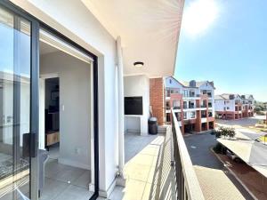 a balcony with a view of a building at Onyx Oasis in Ballito