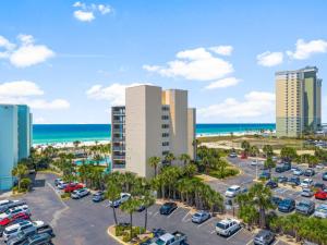 an aerial view of a parking lot in front of the beach at Top Of The Gulf 507 Beach Front Resort Ocean View in Panama City Beach