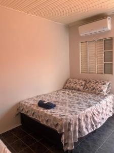 Giường trong phòng chung tại Pousada Encanto