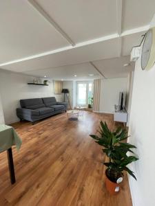 a living room with a couch and a table at Appartement Fa in Périgueux