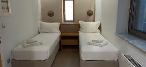 Postel nebo postele na pokoji v ubytování Mani Sol Apartments