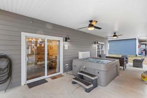a patio with a grill in front of a house at Pineapple Bungalow - 14ppl in Hollister
