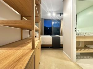 Ένα ή περισσότερα κρεβάτια σε δωμάτιο στο Condomínio Clube - Qto com cozinha - Ar condicionado