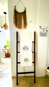 a towel on a chair in a room at Ikal Island Garden in Isla Mujeres