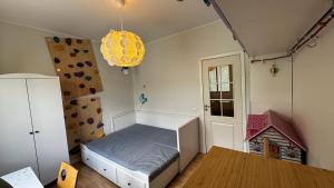 a bedroom with a bed and a rock wall at Spacious Family-friendly Apartment, Free Parking in Tallinn