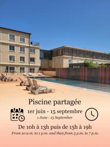 a sign for a swimming pool in front of a building at Studio - Piscine, proche du golf in Juvignac