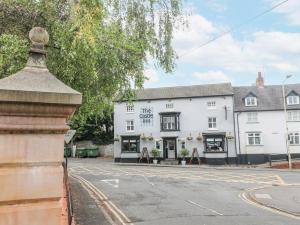 a white building on the corner of a street at Hambleton House in Derby