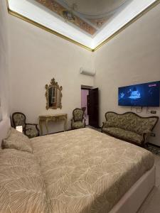 Кровать или кровати в номере Scuderie Il Magnifico